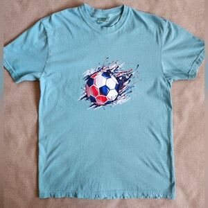 Light green short-sleeve t-shirt with soccer Ball Graphic. Medium Size